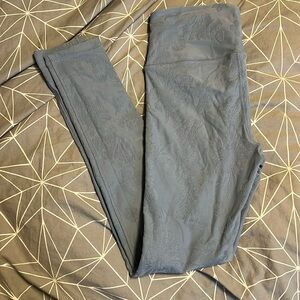 Blue patterned leggings in women’s small.